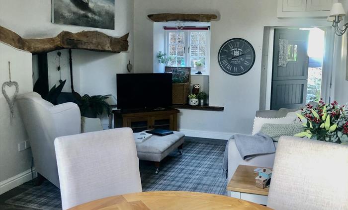 Comfortable dinning area leads onto the kitchen .